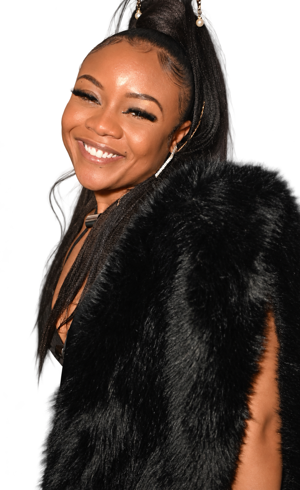 Daisha smiling in a black fur wrap